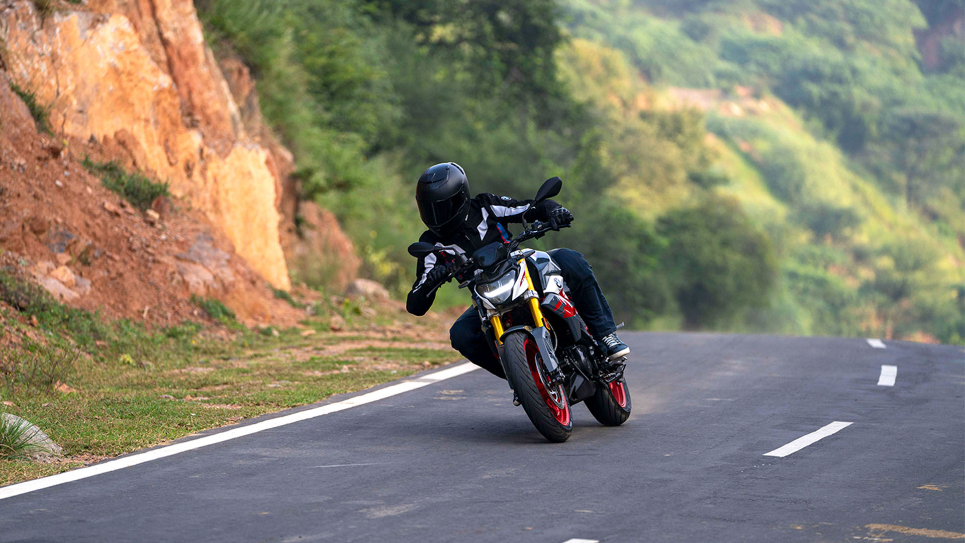 BMW G 310 GS lightweight adventure motorcycle on a road.