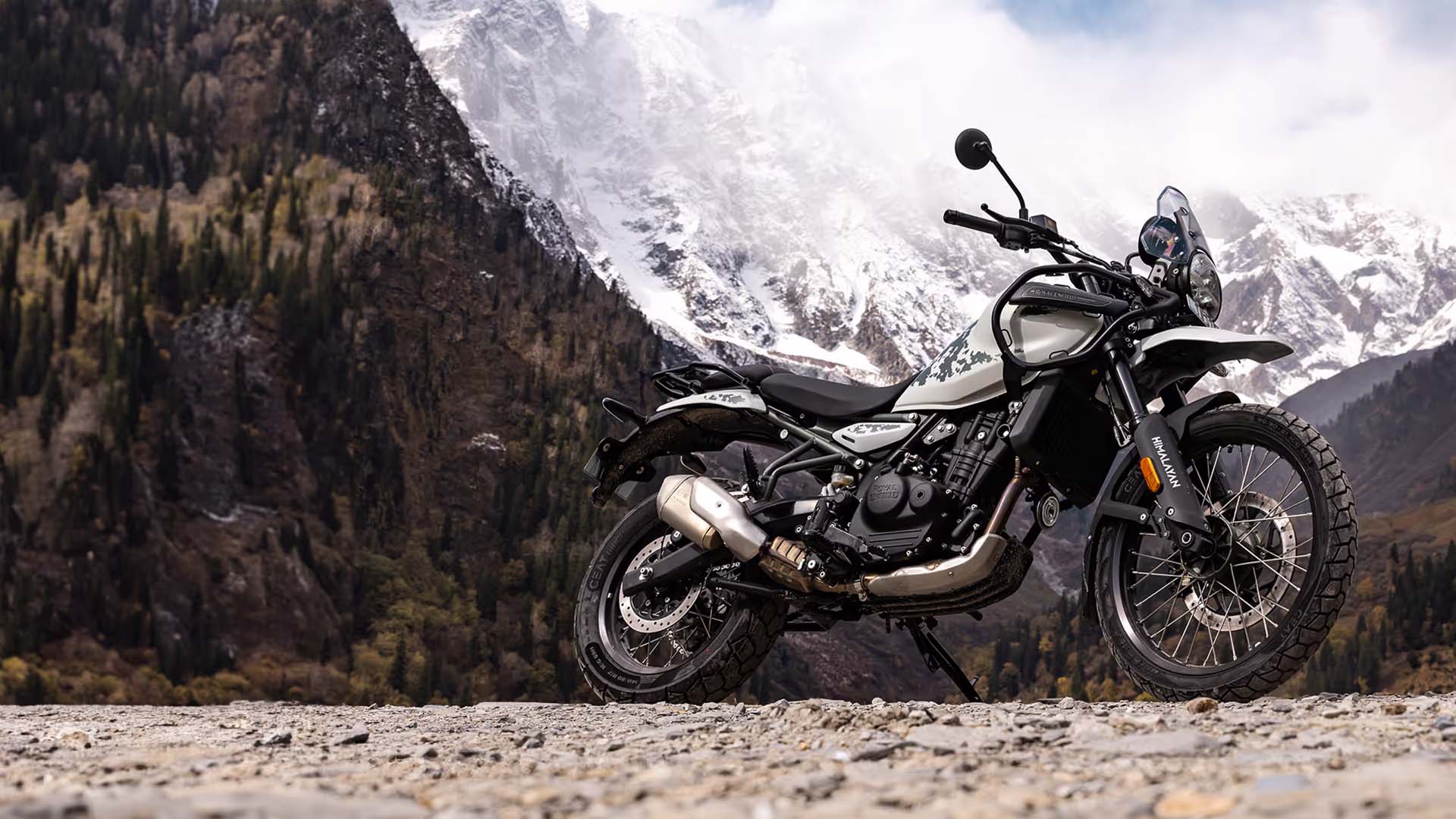 The 2024 Royal Enfield Himalayan 450 parked in front of mountains.